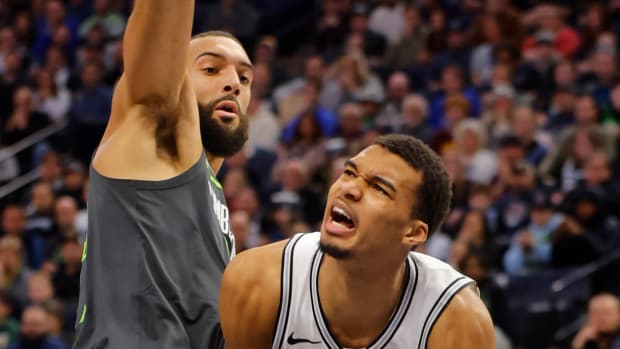 Dec 6, 2023; Minneapolis, Minnesota, USA; San Antonio Spurs forward Victor Wembanyama (1) works around Minnesota Timberwolves center Rudy Gobert (27) in the second quarter at Target Center.